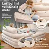 A woman is relaxing on an inflatable bed with a backrest, holding a remote control. The image also shows close-ups of the bed's features, like a cup holder and a connection point. Produktbild-Vorschau