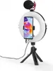 A ring light setup for a smartphone with a microphone attached, placed on a tripod. Produktbild-Vorschau