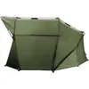 A green bivvy tent is shown against a white background. Voir les images du produit