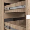 Close-up view of the interior of a wooden dresser or cabinet, showing multiple drawers and metal drawer slides. Voir les images du produit