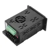 A black electronic device with green connectors and a fan on top, isolated on a white background. Náhled obrázku produktu