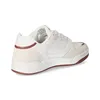 A side view of a white and cream sneaker with red accents. Anteprima dell’immagine prodotto