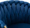 Close-up of a blue velvet chair with gold accents. Náhled obrázku produktu