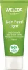 A green tube of Weleda Skin Food Light cream with white text and a white cap. Voir les images du produit