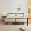 A bedroom scene with a bed, nightstand, and lamp. Voir les images du produit