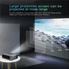 A projector is shown on a table, projecting a large image onto a wall. The image displays text and graphics illustrating projection sizes and distances. Voir les images du produit