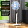 A white stand fan is shown in a room with a window and curtains. There is text overlaid on the left side of the image. Podgląd zdjęcia produktu