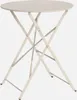 A beige folding bistro table with a round top and a criss-cross metal base. Produktbild-Vorschau