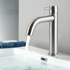 A modern bathroom faucet with water running into a sink. Produktbild-Vorschau