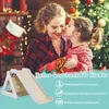 A mother and daughter celebrating Christmas, with a wooden climbing toy in the foreground. Produktbild-Vorschau