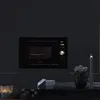 A built-in microwave oven is shown mounted in a dark kitchen cabinet. Anteprima dell’immagine prodotto
