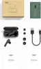 A flat lay of a product box, earbuds and case, charging cable, ear tips, and manuals. Produktbild-Vorschau