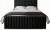 A black upholstered bed with white pillows and a dark gray blanket. Produktbild-Vorschau