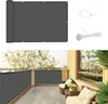 A collage showing a rolled-up dark gray balcony privacy screen and a bundle of zip ties, with a separate image of the screen installed on a balcony. Produktbild-Vorschau