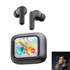A pair of black wireless earbuds and their charging case with a touchscreen display, shown against a white background. A small inset image shows a man using earbuds. Produktbild-Vorschau