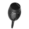A black solar-powered garden torch light. Produktbild-Vorschau
