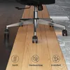 The base of an office chair is shown on a split floor of wood and marble, with icons indicating product features. Náhled obrázku produktu