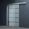 A modern glass sliding door with frosted panels and horizontal black stripes, mounted on a wall. Produktbild-Vorschau