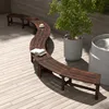A curved wooden bench is placed on a wooden deck next to a potted plant and a water feature. Náhľad obrázku produktu