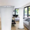 A modern living room with a sofa, coffee table, and large windows. Produktbild-Vorschau