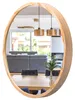 A round mirror with a wooden frame reflects a dining area and living room. Anteprima dell’immagine prodotto