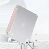A clear protective case with a pink accent is shown on an iPad, appearing to be falling onto a broken surface. Produktbild-Vorschau
