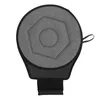 A top-down view of a round, gray seat cushion with a hexagonal pattern and a black strap at the bottom, isolated on a white background. Produktbild-Vorschau