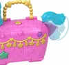 A close-up shot of a pink piñata-shaped toy purse with gold and star decorations. Náhled obrázku produktu