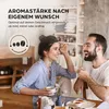 A couple is enjoying coffee together at a table, with text overlay indicating customizable aroma strength. Produktbild-Vorschau