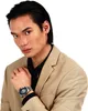 A man wearing a suit and a watch. Produktbild-Vorschau