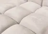 A close-up view of a tufted, light-colored fabric surface, likely a cushion or mattress. Produktbild-Vorschau