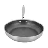 A stainless steel frying pan with a honeycomb pattern on a white background. Podgląd zdjęcia produktu