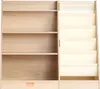 A wooden bookshelf with fabric pockets on the right side, presented against a white background. Náhled obrázku produktu
