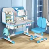 A child's desk and chair set in a blue room. Produktbild-Vorschau