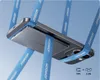 A smartphone is suspended by blue straps, demonstrating its magnetic holding capability. Produktbild-Vorschau