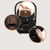 A collage of images showing a black baby car seat with close-up views of its features. Produktbild-Vorschau