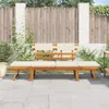 A wooden garden bench with beige cushions is placed on a paved patio in front of a wooden fence. Voir les images du produit