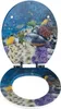An open toilet seat and lid with a 3D effect image of a coral reef and fish. Náhled obrázku produktu