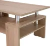 A close-up view of a modern coffee table with a wood-grain finish and chrome legs. Voir les images du produit