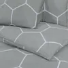 A close-up view of a grey duvet cover with a white geometric pattern. Produktbild-Vorschau