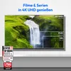 A television screen displaying a waterfall scene, with overlays indicating different resolutions (4K UHD, FHD, HD). Below the screen are marketing badges and awards. Produktbild-Vorschau