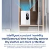 A white dehumidifier is shown inside a closet, with blue vapor emanating from the top, suggesting air purification or drying. Produktbild-Vorschau