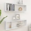 Two white cube shelves mounted on a white wall, decorated with books, picture frames, vases, and a clock. Voir les images du produit