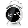 A white retro-style digital alarm clock with a black display showing the time. Anteprima dell’immagine prodotto