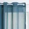 A close-up view of a blue curtain hanging from a white curtain rod. Podgląd zdjęcia produktu