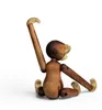 A wooden monkey toy sitting on a white background. Anteprima dell’immagine prodotto