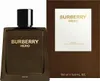 A bottle of Burberry Hero Parfüm and its packaging are displayed against a white and brown background. Voir les images du produit
