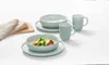 A set of light blue tableware, including bowls and mugs, arranged on a white surface. Produktbild-Vorschau