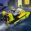 A LEGO boat is speeding through the water with buildings in the background. Anteprima dell’immagine prodotto