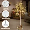 A decorative LED birch tree with warm white lights is set up indoors, likely for holiday decoration, with gifts and an elephant figurine at its base. Anteprima dell’immagine prodotto